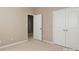 Bedroom with neutral walls, carpet, and double doors at 5030 Monacan Way, Indian Land, SC 29707