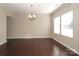 Bright dining room features hardwood floors and elegant chandelier at 5030 Monacan Way, Indian Land, SC 29707