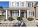 Inviting front entrance with a covered porch and stone accents at 5030 Monacan Way, Indian Land, SC 29707