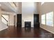 Two-story living room with hardwood floors and a fireplace at 5030 Monacan Way, Indian Land, SC 29707