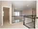 Upstairs hallway with carpeted floors and railing at 5030 Monacan Way, Indian Land, SC 29707