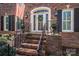 Elegant front entry with brick steps and a decorative door at 517 Stuart Ridge None, Cramerton, NC 28032