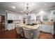 Spacious kitchen with white cabinets, granite counters and an island at 517 Stuart Ridge None, Cramerton, NC 28032