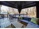 Covered patio with seating area, grill, and pool; perfect for outdoor entertaining at 5229 Mt Holly Huntersville Rd, Charlotte, NC 28216