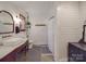 Charming bathroom with shiplap walls, a vintage vanity, and a walk-in shower at 5229 Mt Holly Huntersville Rd, Charlotte, NC 28216