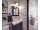 Stylish bathroom with shiplap walls and modern fixtures at 5229 Mt Holly Huntersville Rd, Charlotte, NC 28216