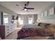 Spacious bedroom with large windows and ceiling fan at 5229 Mt Holly Huntersville Rd, Charlotte, NC 28216