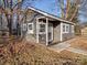 Gray cottage with covered porch, landscaping, and garden at 5229 Mt Holly Huntersville Rd, Charlotte, NC 28216