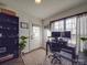 Home office with built-in shelving and large windows at 5229 Mt Holly Huntersville Rd, Charlotte, NC 28216