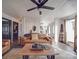 Inviting living room with leather sofa, wood floors, and a stylish ceiling fan at 5229 Mt Holly Huntersville Rd, Charlotte, NC 28216