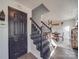 Dark-stained wooden staircase leading upstairs at 5229 Mt Holly Huntersville Rd, Charlotte, NC 28216