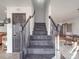 Dark-stained wooden staircase with simple railing at 5229 Mt Holly Huntersville Rd, Charlotte, NC 28216