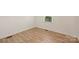 Spacious bedroom with light-colored walls and wood-look flooring at 533 Wakefield Dr # B, Charlotte, NC 28209