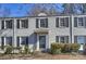 Brick building with gray shutters, a black door, and well-manicured hedges at 533 Wakefield Dr # B, Charlotte, NC 28209