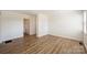 Light-filled living room with hardwood floors and neutral walls at 533 Wakefield Dr # B, Charlotte, NC 28209