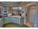 Kitchen with granite countertops, light blue cabinets, and a view of the Gathering room at 5424 Amanda Ln, Belmont, NC 28012