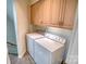 Laundry room with washer, dryer, and upper cabinets at 5424 Amanda Ln, Belmont, NC 28012