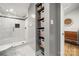 Bathroom with shower, built-in shelving, and gray walls at 59 Ridgeport Rd, Clover, SC 29710