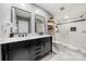 Bathroom with double vanity, marble countertop, and frameless shower at 59 Ridgeport Rd, Clover, SC 29710