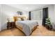 Cozy bedroom with yellow headboard, wood floors, and gray bedding at 59 Ridgeport Rd, Clover, SC 29710