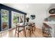 Modern glass dining table with mid-century chairs at 59 Ridgeport Rd, Clover, SC 29710