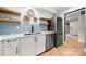 Updated kitchen featuring white cabinets, stainless steel appliances, and light blue tile backsplash at 59 Ridgeport Rd, Clover, SC 29710