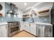 Modern kitchen with stainless steel appliances and light blue tile backsplash at 59 Ridgeport Rd, Clover, SC 29710