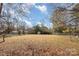 Large backyard with shed and chain link fence at 6208 Karenstone Dr, Charlotte, NC 28215