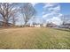 Large backyard with a view of neighboring houses at 6208 Karenstone Dr, Charlotte, NC 28215