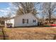 House exterior view with a backyard and storage shed at 6208 Karenstone Dr, Charlotte, NC 28215