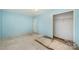 Simple bedroom with light blue walls and closet at 6208 Karenstone Dr, Charlotte, NC 28215