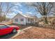 Side view of the house, showing a driveway and yard at 6208 Karenstone Dr, Charlotte, NC 28215