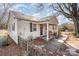 Side view of a ranch home with a walkway and small fence at 6208 Karenstone Dr, Charlotte, NC 28215