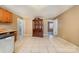 Kitchen with tiled floor and wood cabinets at 6208 Karenstone Dr, Charlotte, NC 28215