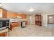 Kitchen features wood cabinets and tile floors at 6208 Karenstone Dr, Charlotte, NC 28215