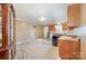 Bright kitchen with wood cabinets and tile floor at 6208 Karenstone Dr, Charlotte, NC 28215