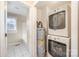 Stacked washer and dryer in a small laundry room at 6208 Karenstone Dr, Charlotte, NC 28215