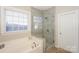 Bathroom with soaking tub and walk in shower at 626 Lorain Nw Ave, Concord, NC 28027