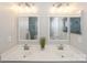 Double vanity bathroom with large mirrors and built in shelving at 626 Lorain Nw Ave, Concord, NC 28027