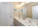 Clean bathroom with double vanity and a large mirror at 626 Lorain Nw Ave, Concord, NC 28027