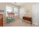 Well-lit bedroom with a dollhouse and plenty of closet space at 626 Lorain Nw Ave, Concord, NC 28027