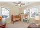 Charming bedroom with a crib and a play area, perfect for a Bedroom at 626 Lorain Nw Ave, Concord, NC 28027