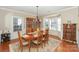 Formal dining room with hardwood floors, a large table, and bay window at 626 Lorain Nw Ave, Concord, NC 28027