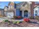 Two-story house with stone accents, a front porch, and landscaping at 626 Lorain Nw Ave, Concord, NC 28027