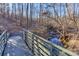 Wooden footbridge over a creek in a wooded area at 626 Lorain Nw Ave, Concord, NC 28027