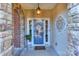 Inviting front entry with a blue door, stone accents, and decorative wreath at 626 Lorain Nw Ave, Concord, NC 28027