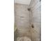 Walk-in shower with built-in seat and tiled walls at 626 Lorain Nw Ave, Concord, NC 28027