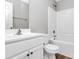 Clean bathroom with white vanity, toilet, and bathtub at 6603 Wandering Creek Dr, Charlotte, NC 28216