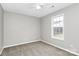 Bright bedroom with neutral walls, carpet, and a window offering natural light at 6603 Wandering Creek Dr, Charlotte, NC 28216