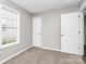 Simple bedroom with neutral walls, carpet flooring, and two closets at 6603 Wandering Creek Dr, Charlotte, NC 28216